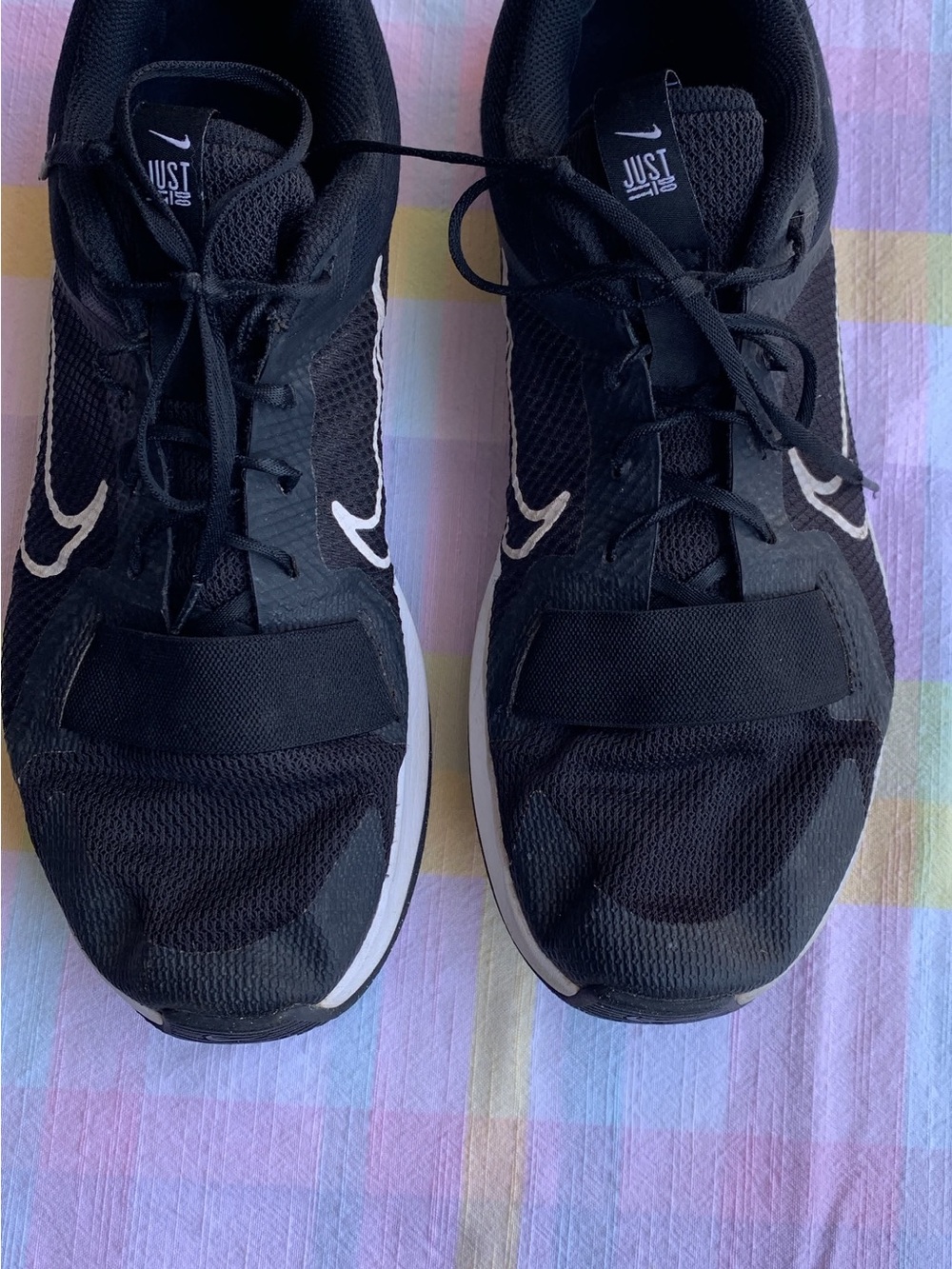 Nike Black Sneakers with White Swoosh Accent